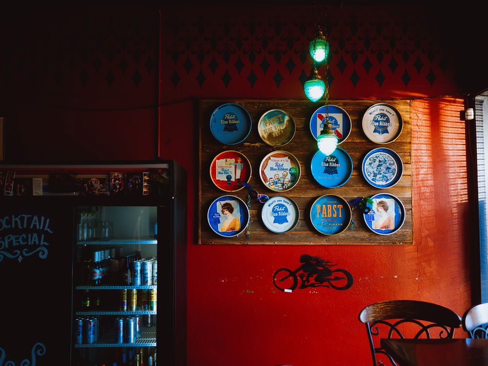 Decorative serving trays on a red wall