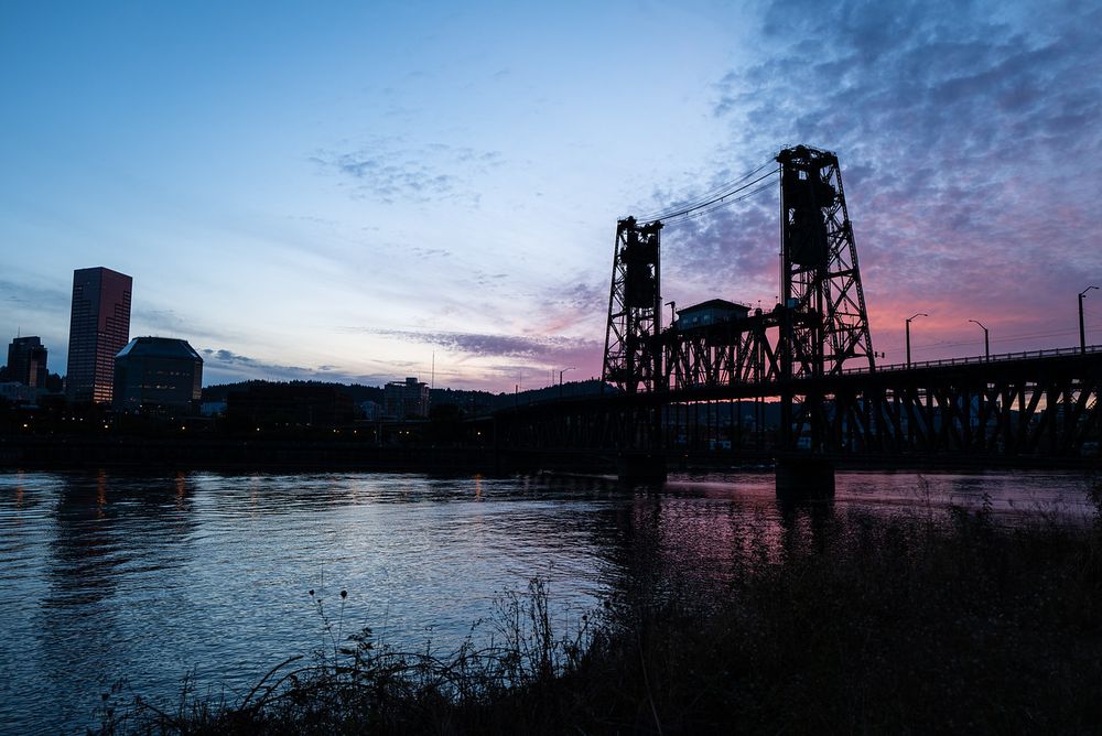Wide angle shot of the Steel Bridge with soft sunset colors