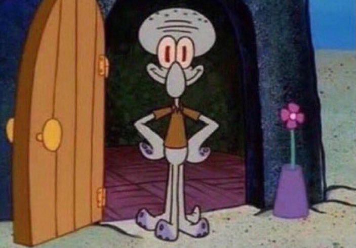 Squidward smiling with his hands on his hips 