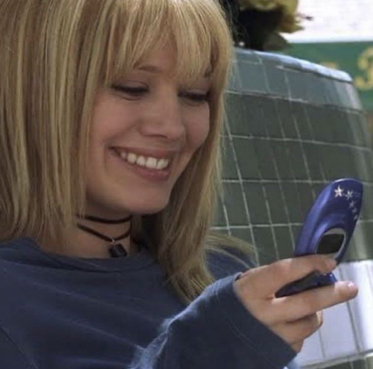 Hillary duff smiling at her phone