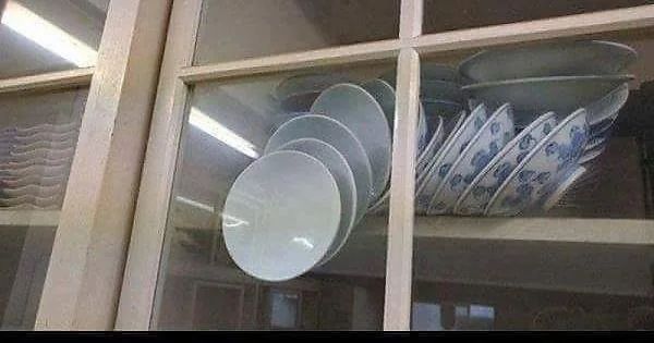 it's the schrodinger's plates meme. With the plates that will definitely fall and crash when you open the cabinet door, but will stay unbroken if you don't open the door