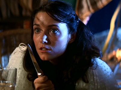 Karen Allen, as Marion Ravenwood, threatening a Nazi with a knife in “Raiders of the Lost Ark”.