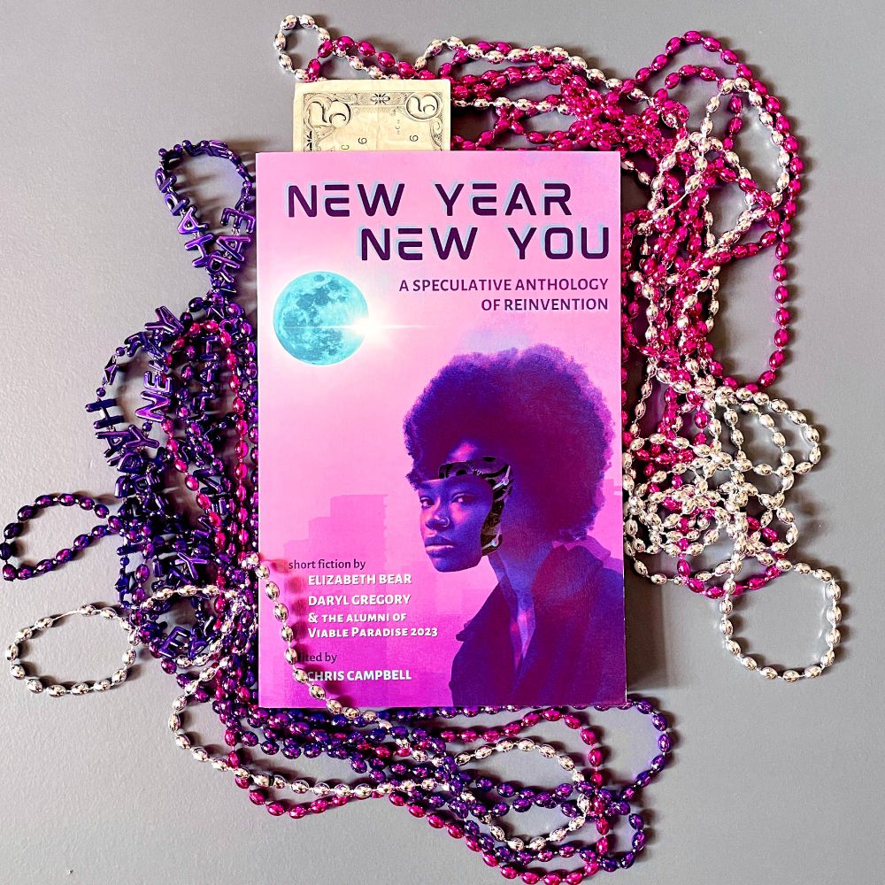 A pink and purple paperback copy of New Year, New You: A speculative Anthology of Reinvention displayed against a backdrop of pink, purple, and silver mardi gras beads, with a $5 sticking out like a bookmark because this awesome anthology is currently on sale for less that $5 on Amazon. WHAT? Go buy it now!
