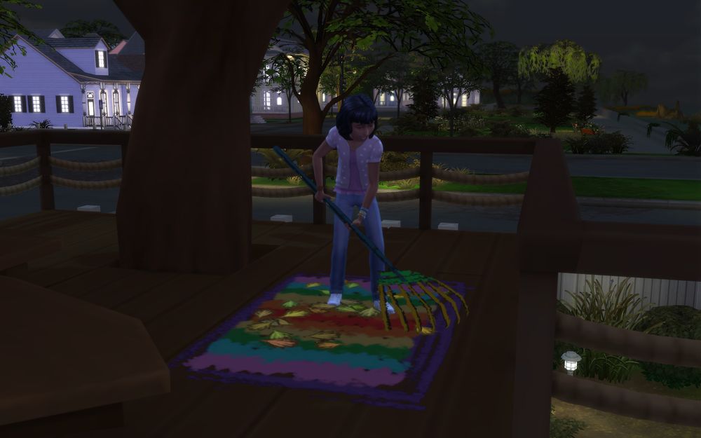 Tasha pretends to rake imaginary leaves in the treehouse.