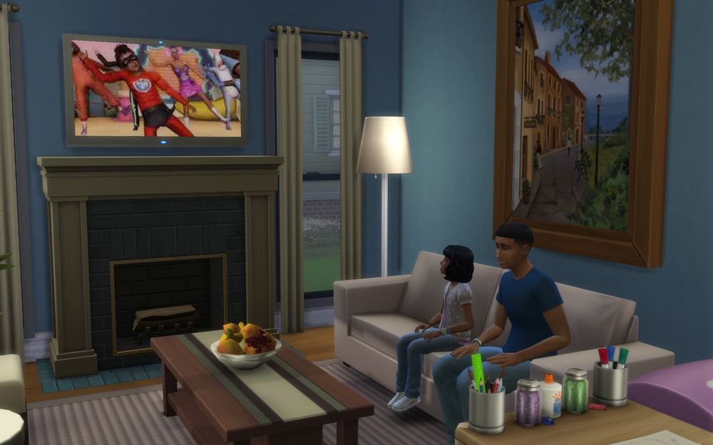 Tasha and Max watch a TV show with superhero kids.