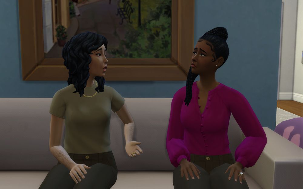 Alina and Melanie look sad as they sit on the sofa and talk.