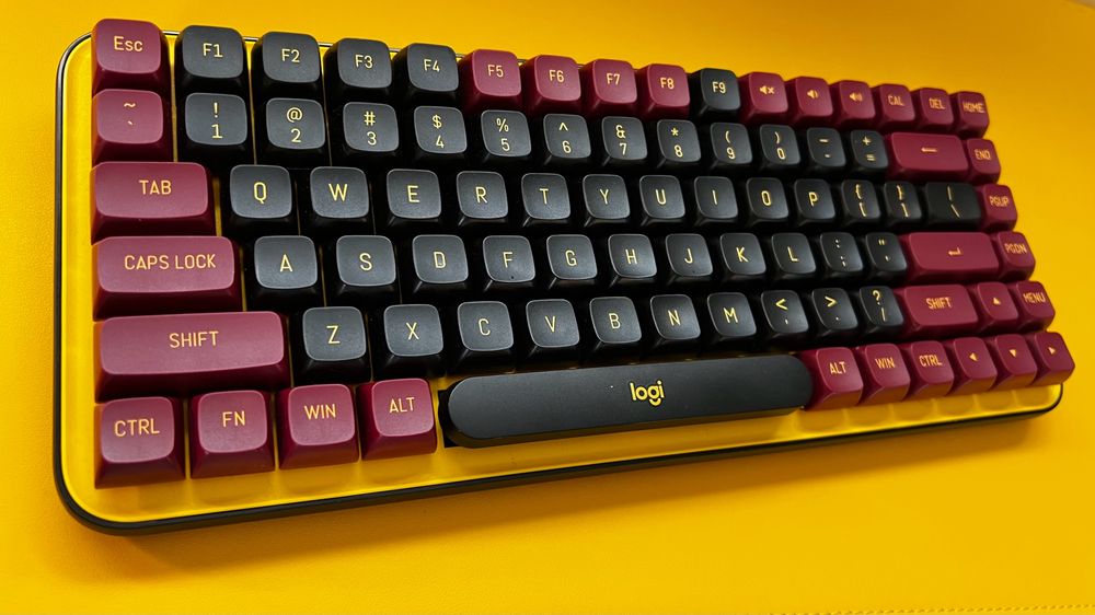 Top angled view of a small tenkey-less mechanical keyboard with custom keys