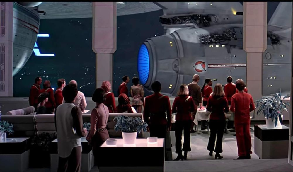 The battle damaged enterprise pulls into space dock at the beginning of Star Trek three the search for Spock