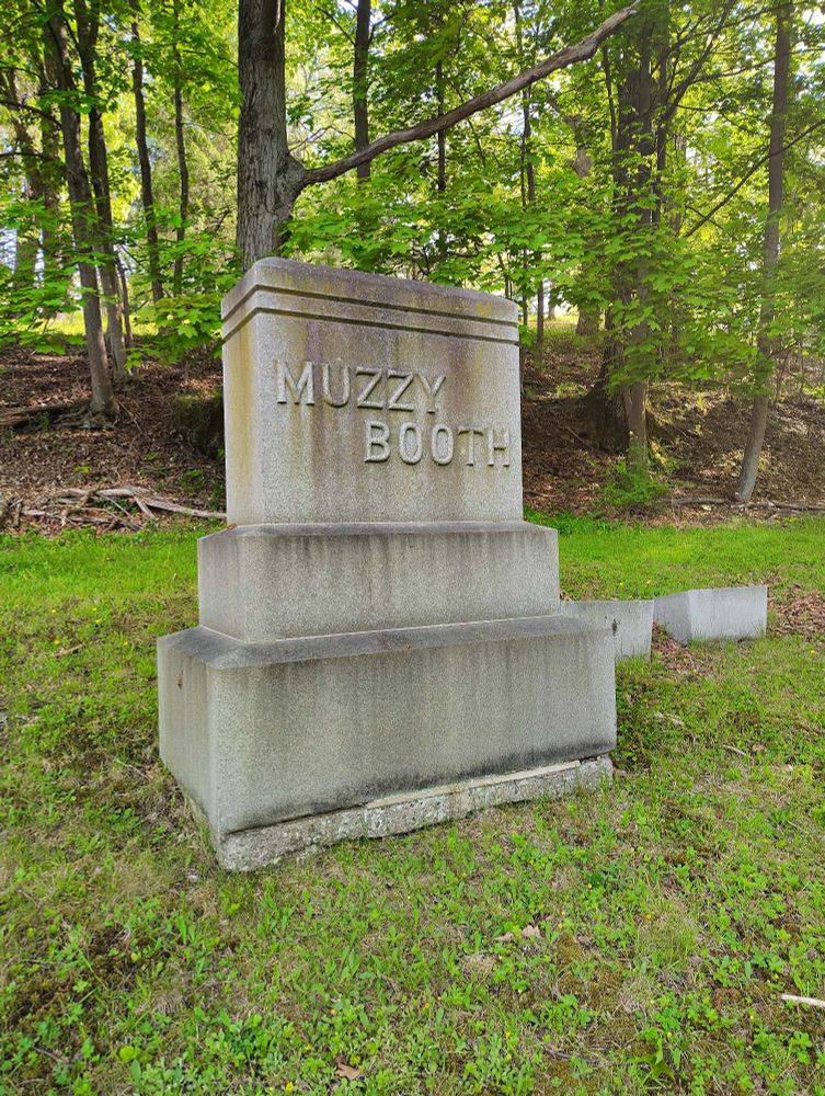 Photo of a gravestone labeled " MUZZY BOOTH"