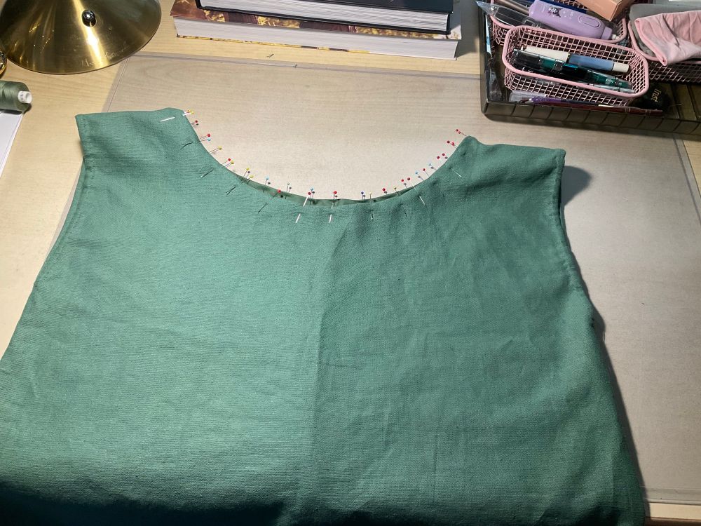 Olive green bodice with bias binding sew and pinned.