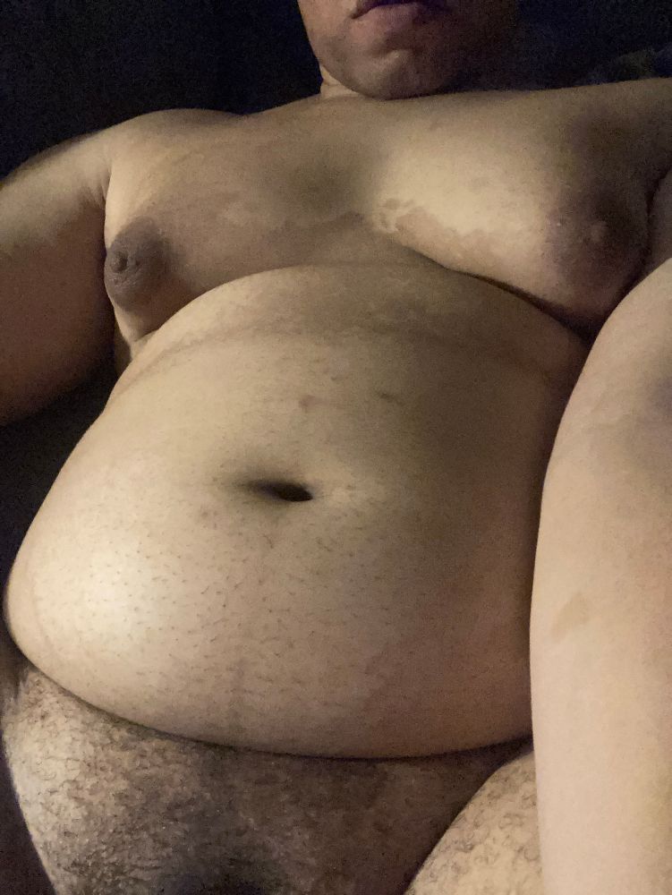 Another torso selfie with her lying down. The lighting is much better.