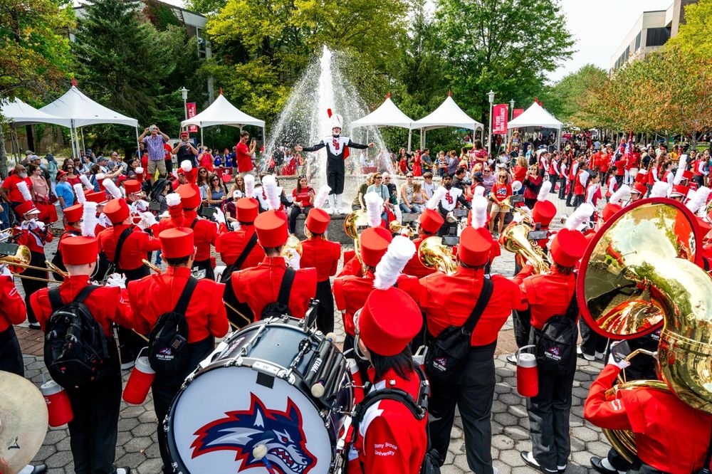 The Stony Brook Marching Band surrounding the Fountain outside of Administration on Communiversity Day 2025.