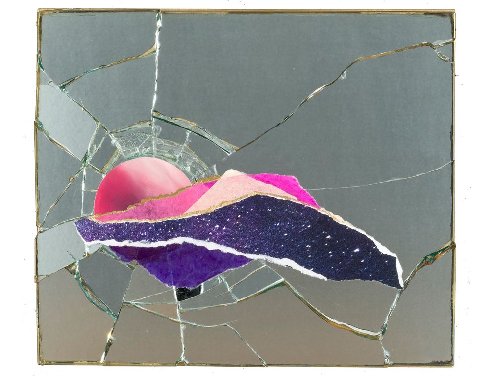 A collage made from a broken mirror, with radiating cracks surrounding a layered composition of torn paper. The paper fragments resemble a stylized sunset landscape, featuring a deep pink sun partially obscured by jagged layers of bright magenta, soft peach, star-speckled navy, and rich violet. The reflective mirror fragments frame the vivid scene, adding texture and depth, evoking the fractured beauty of a summer sunset. Artwork by Allison Belolan.

