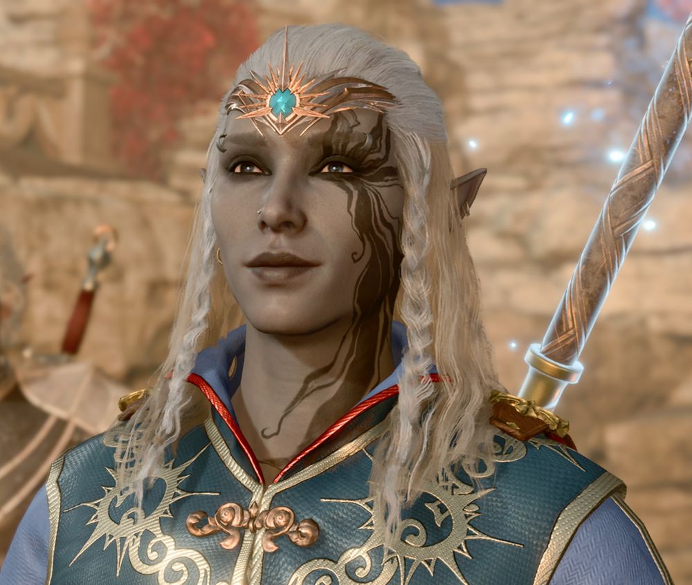 original talice. she had gray skin, black eyes, white hair, and a black swirling tattoo on the left side of her face. in this pic she's wearing a blue robe.