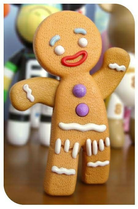 Gingerbread man from Shrek waving.