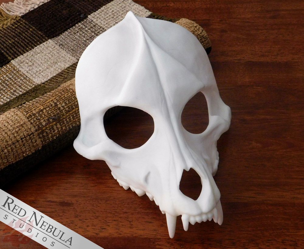 A white resin-cast wolf skull mask.