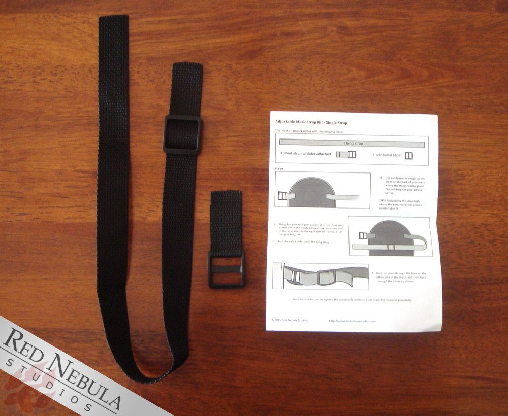 A mask strap kit with an instruction guide sitting beside it (mostly unreadable in photo)