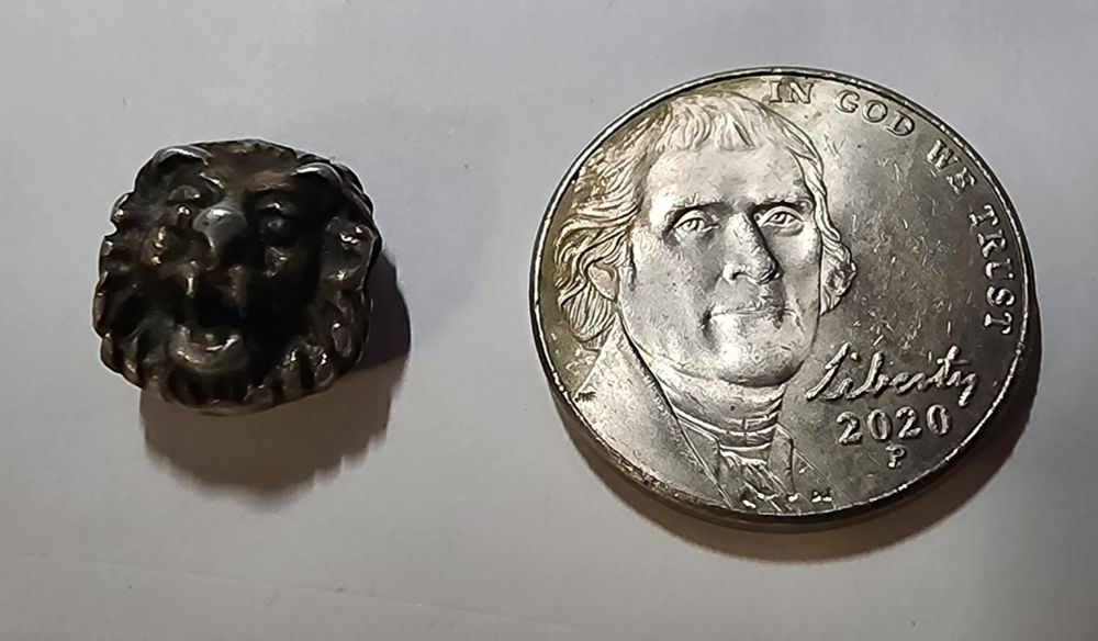 The charm next to a nickle