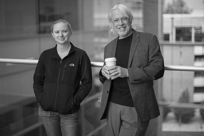 Black and white photo of myself and my graduate advisor Robert Marc standing on an elevated walkway. Photo taken in 2015 by @BWJones