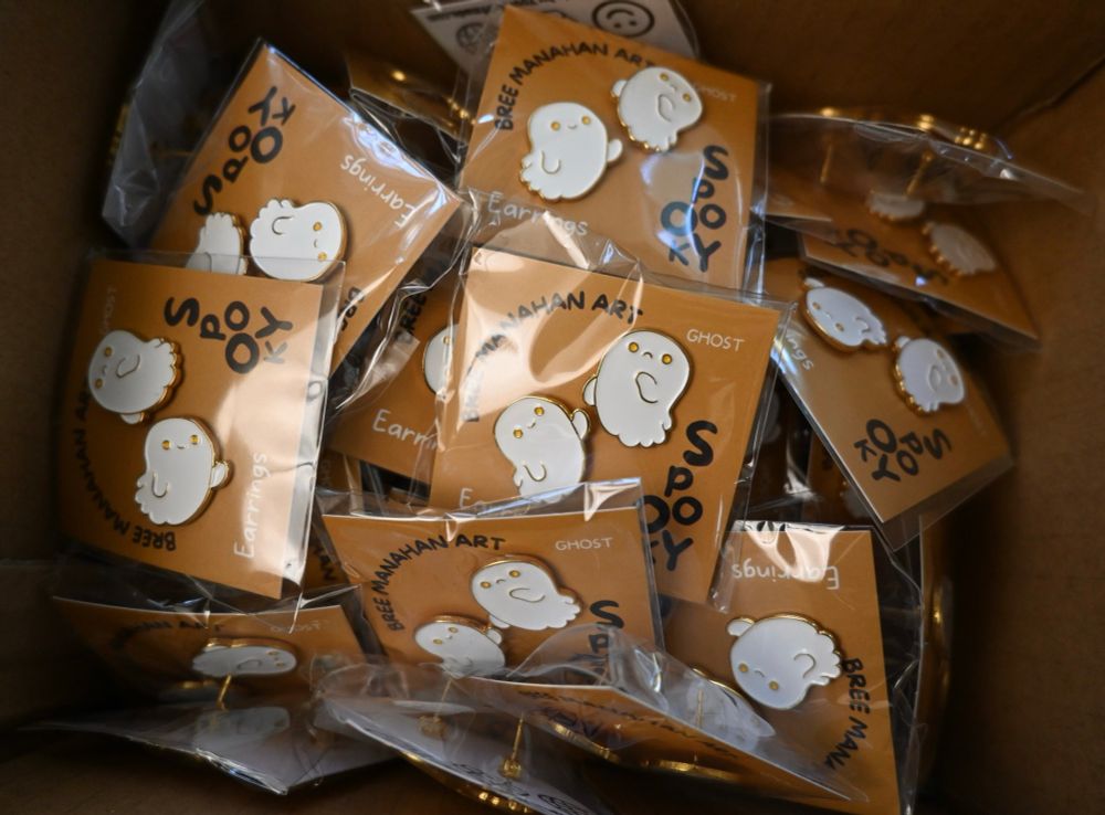 A box filled with ghost earrings, awaiting their new haunts. 