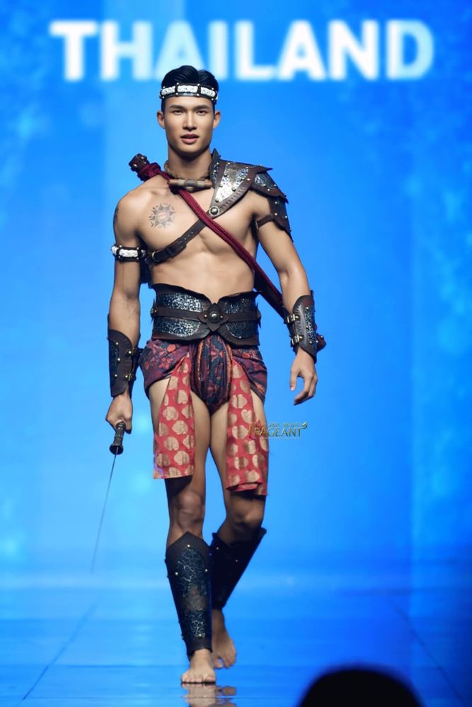 so,  um,   alt txt:  a Thai man who did not forget leg day, wears traditional-ish warrior loincloth and armor.  He is unbelievably, unreasonably, infeasibly HOT!