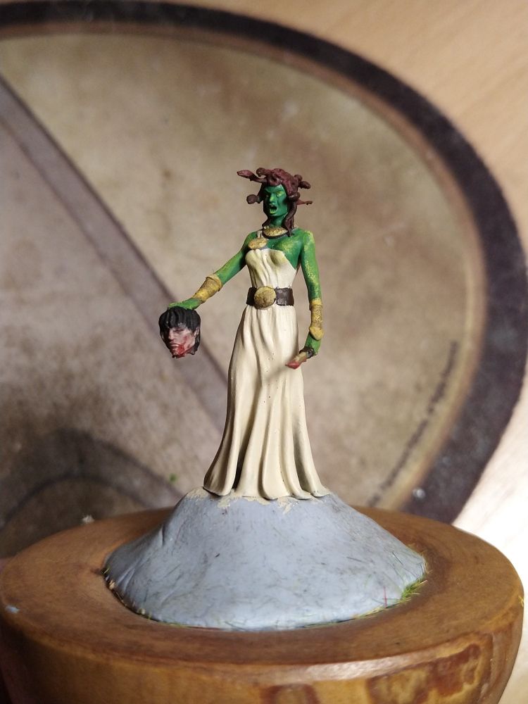 Painted miniature of Medusa. 