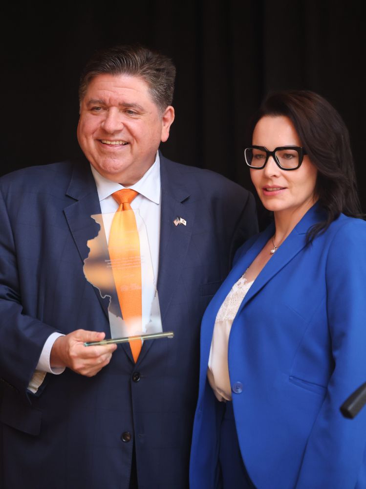 Governor Pritzker receives the Champion for Families Award from One Family Illinois.