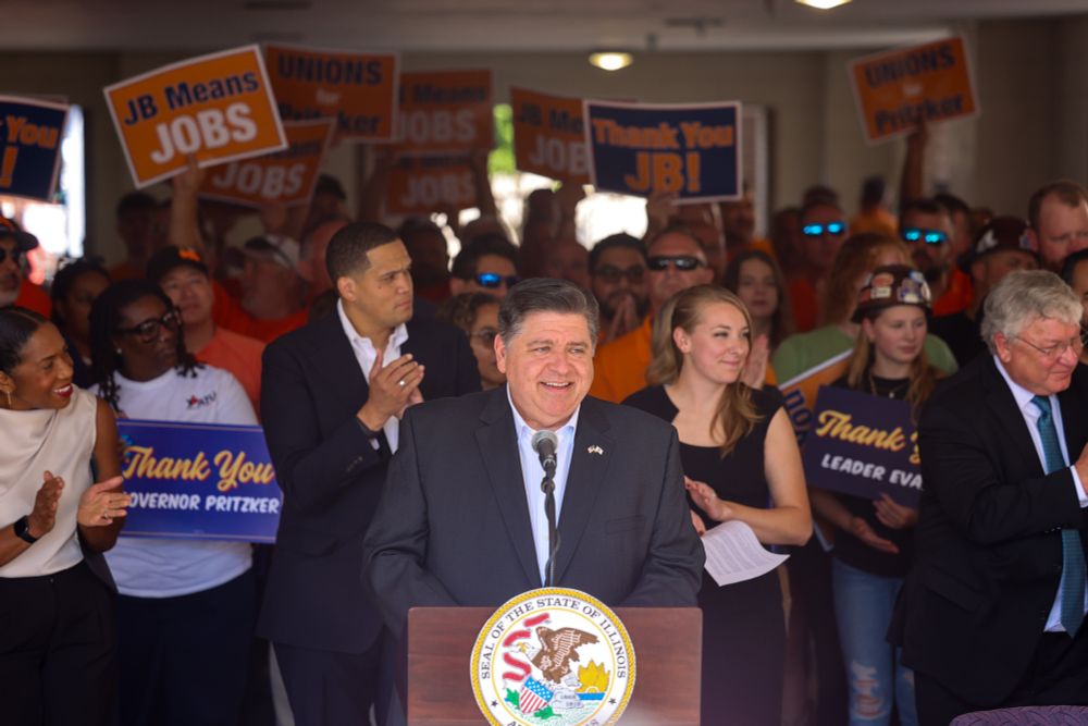Governor Pritzker speaks at the podium.