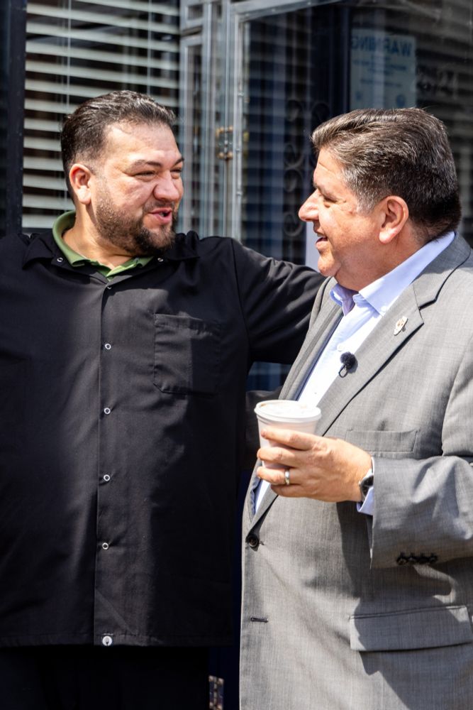 Governor Pritzker talks to the owner of Los Candiles.