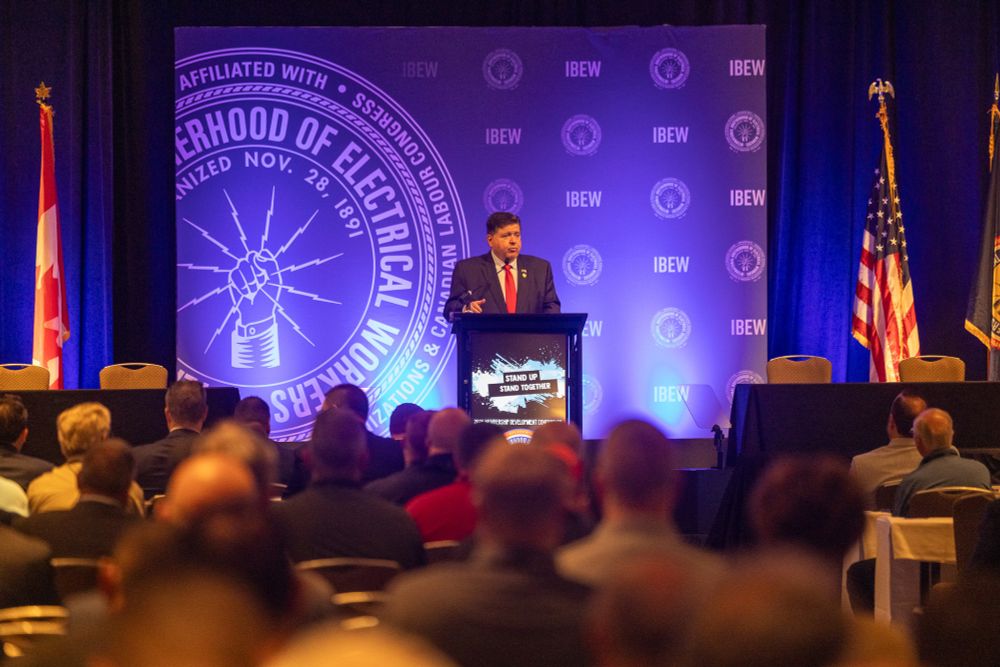 Governor Pritzker speaks at an IBEW conference.