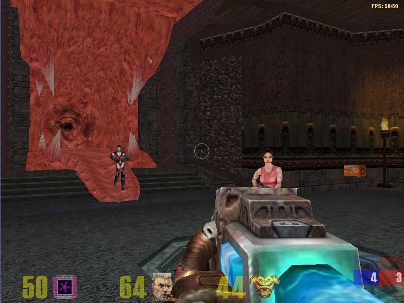 A first person view of a gothic castle interior with a flesh maw embedded into the wall to the left. There are two women in frame, the further one standing on the tongue of the flesh maw and closer one is standing to the right of the crosshair. The player is holding the plasma gun from Quake 3 Arena. At the bottom there are stats which includes the players ammo count; which is at 50 and indicated by a purple square. The player's remaining life; which is at 64 and displayed next to an icon of the character's head. Their armor value set at 44; which is next to a golden chestplate icon. The score of the match; which is currently 4 to 3. The FPS counter is shown in the top right corner and that reads that it's running at 50 out of 50 frames.
