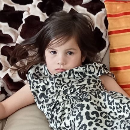 my 4yo daughter looking at the camera with an intense unimpressed stare