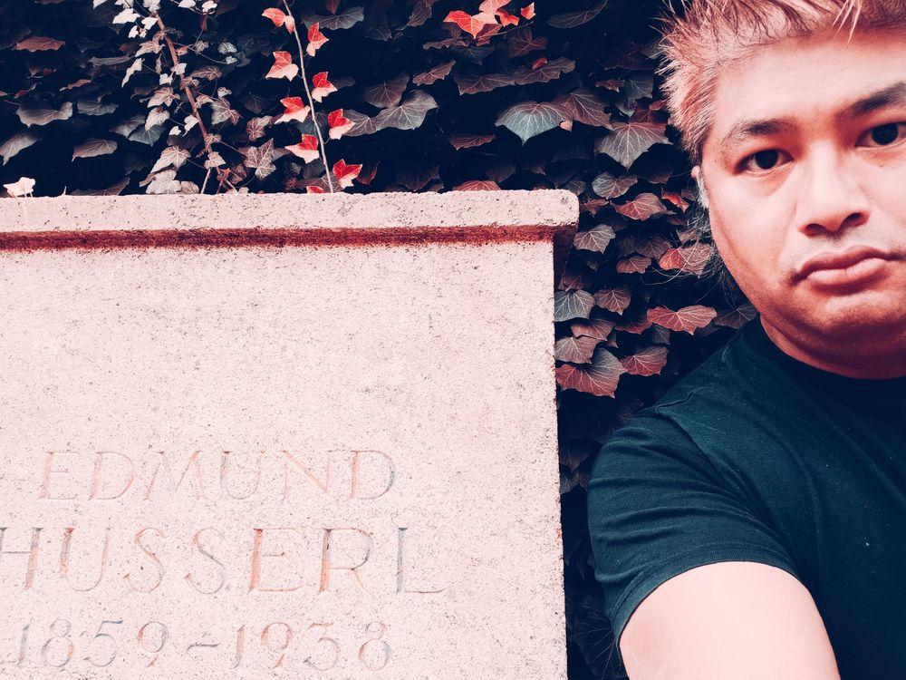 me standing next to Edmund Husserl's (1859–1938) grave
