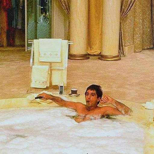 Al Pacino as Tony Montana sitting in a hot tub