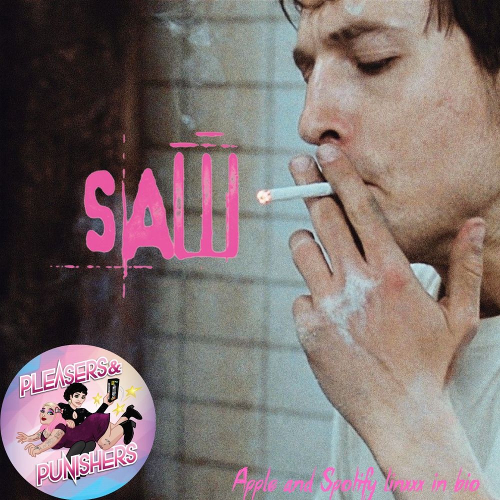 A still from Saw (2004) of Adam smoking a cigarette. The SAW logo appears in a pink font near the center of the image. The pleasers & Punishers logo appears in the bottom left corner. The text "Apple and Spotify linxxx in bio" appears in the bottom right corner.