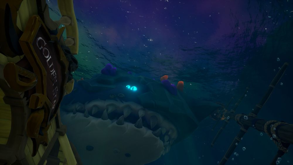 Underwater there is the ship and the crest of the “Golden Star” 

Looming over the wreck is the barnacle dread Meg 
