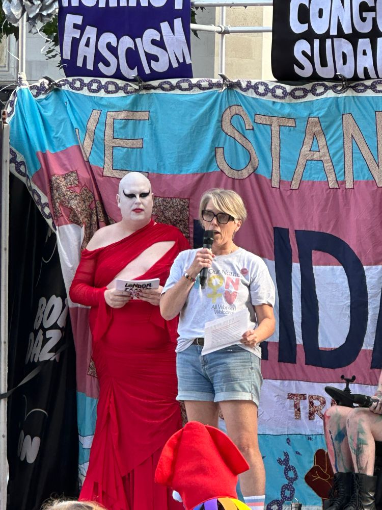 Caroline Litman on stage at London Trans+ Pride making a speech