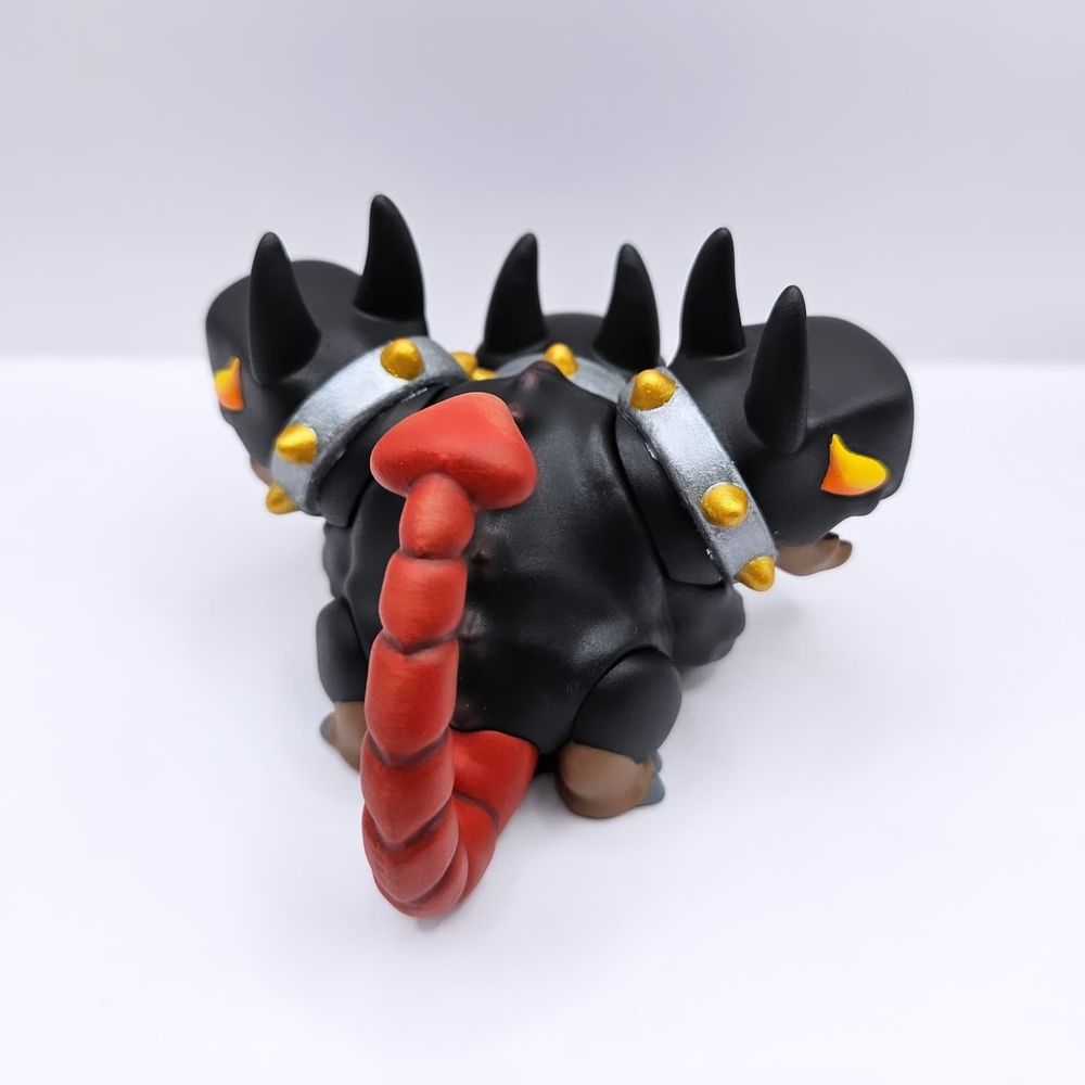 Cerberus themed toy. Showing off red scorpion tail