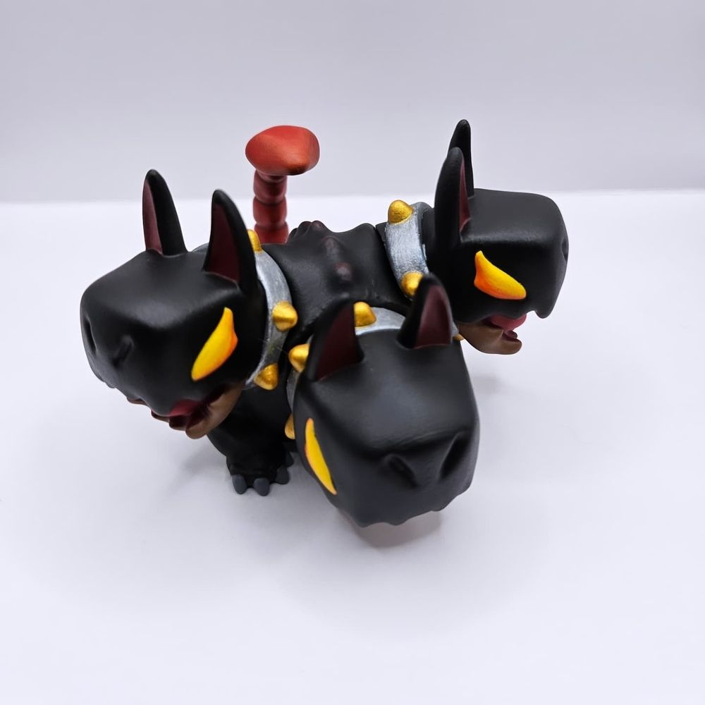 Cerberus themed toy with silver and gold collars