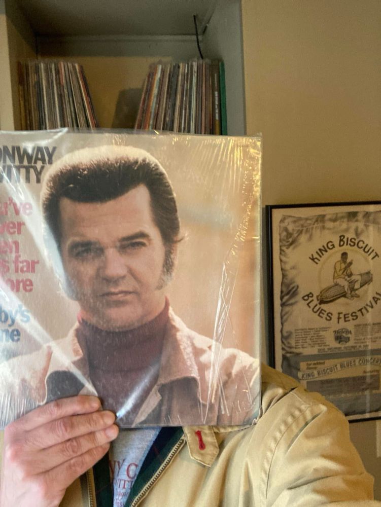 Conway Twitty album held up in front of my face 