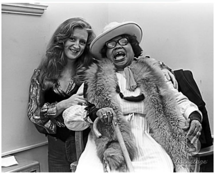 Old Sippie Wallace with cane laughing & sitting with a young Bonnie Raitt