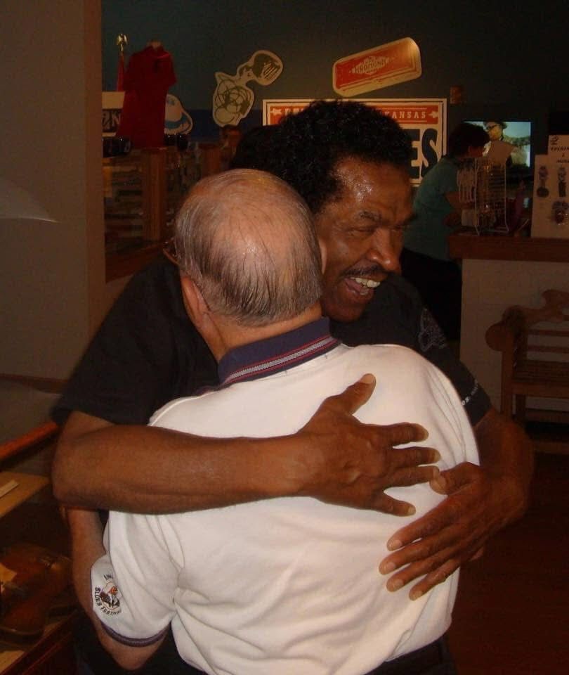 Bobby Rush hugs Sonny Payne