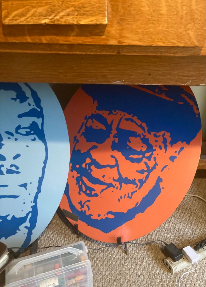 Large portrait of Lockwood in blue on orange background 