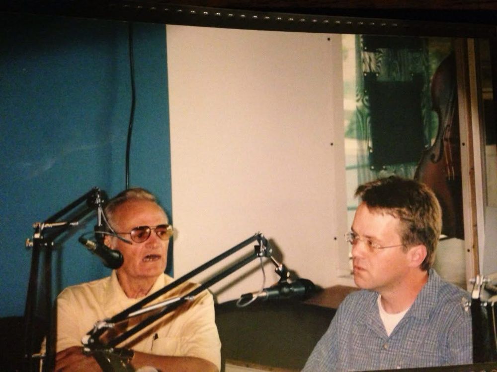 Jimmy Evans & me talking behind microphones at radio KFFA in 2006