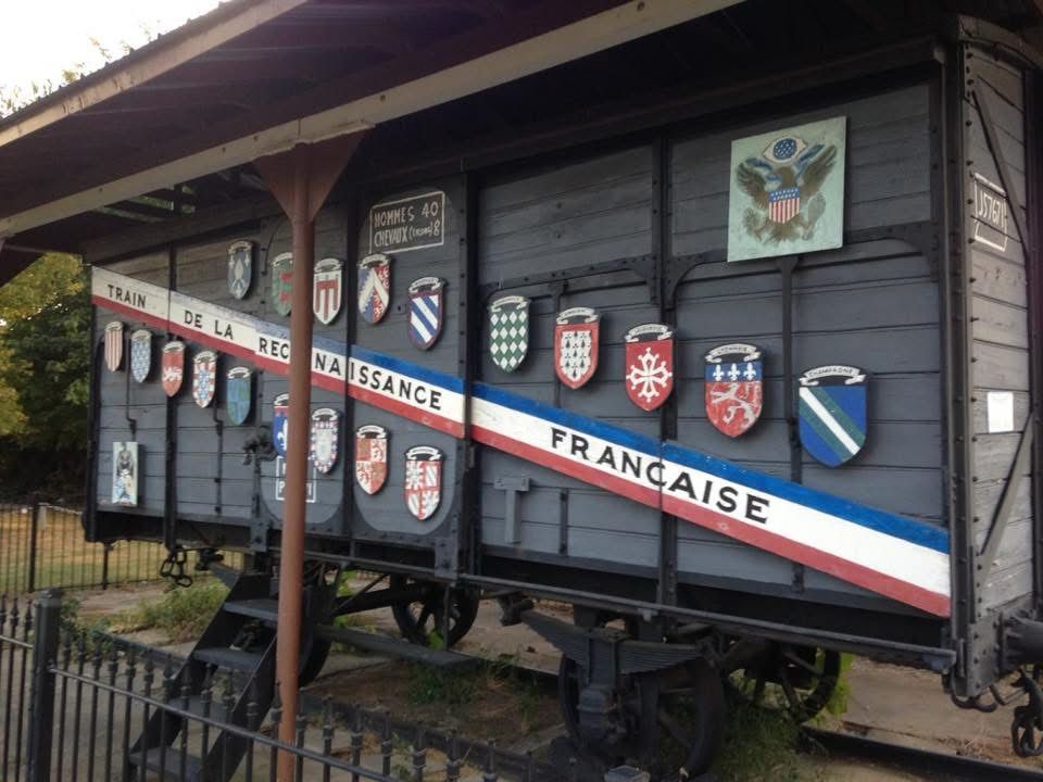Merci train car at Helena’s American Legion.
It’s an old wooden boxcar covered in badges/shield things.
Diagonal red/white/blue sash/stripe says
“Train de la reconnaissance francaise.”