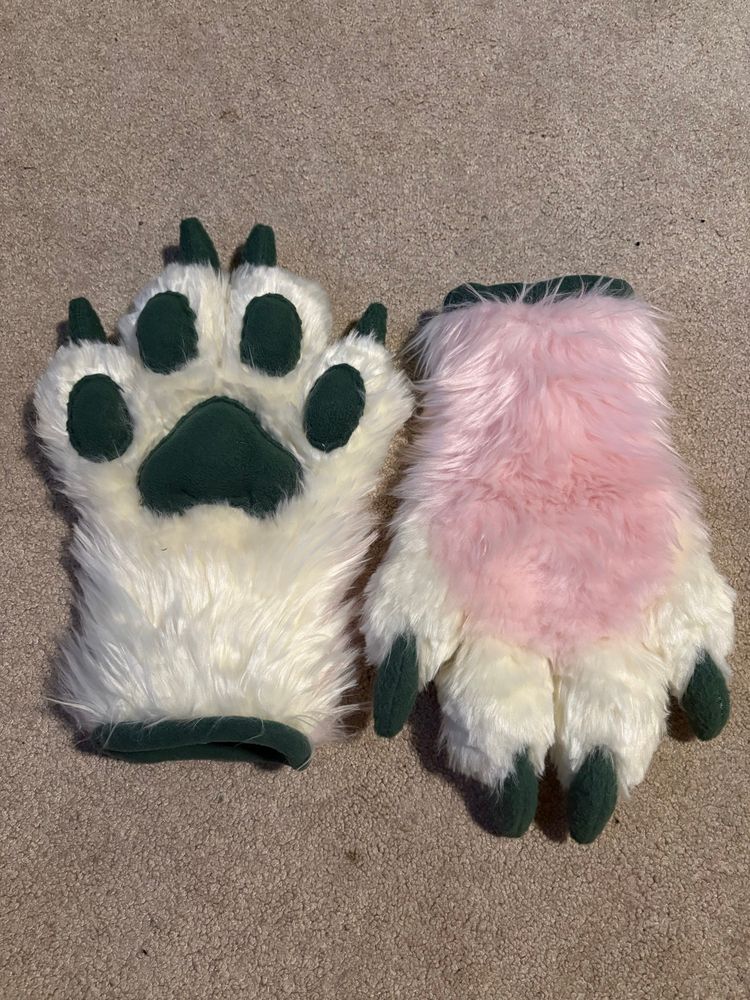 pink and white tiger fursuit paws with green beans and claws