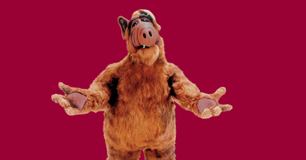 ALF, hands stretched in front of him, palms pointed up.