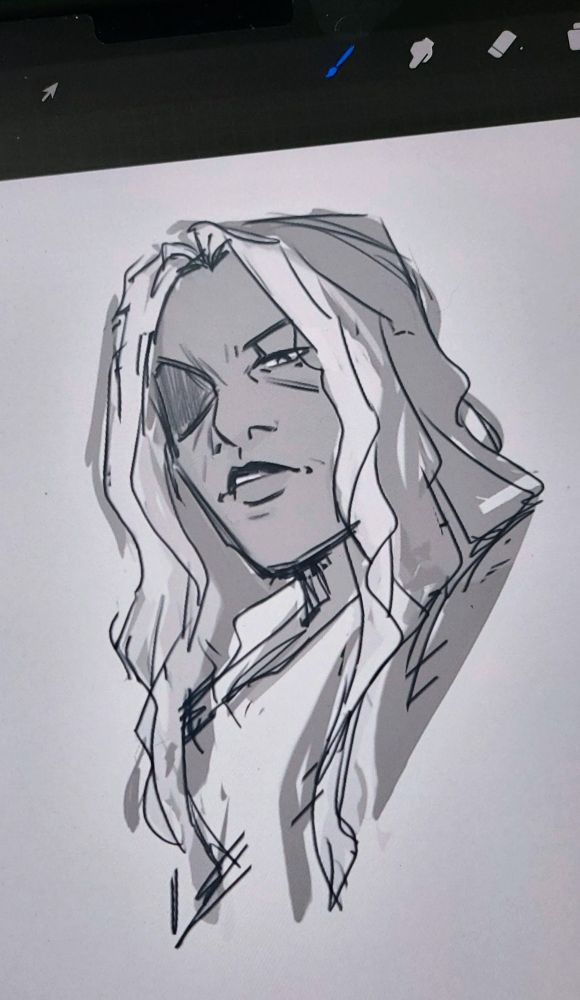 An older woman with a patch over her left eye and long hair. The image is in grayscale, but two white strands still stand out as they frame her face.