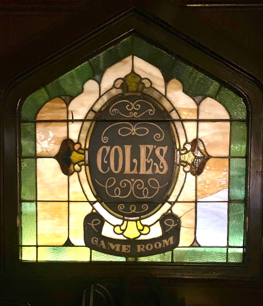 A stained glass window that reads “Cole’s Game Room.”