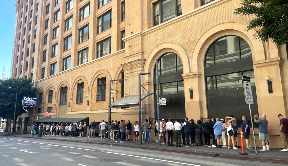 The long line of people waiting outside Cole’s. Photo taken from across the street. 